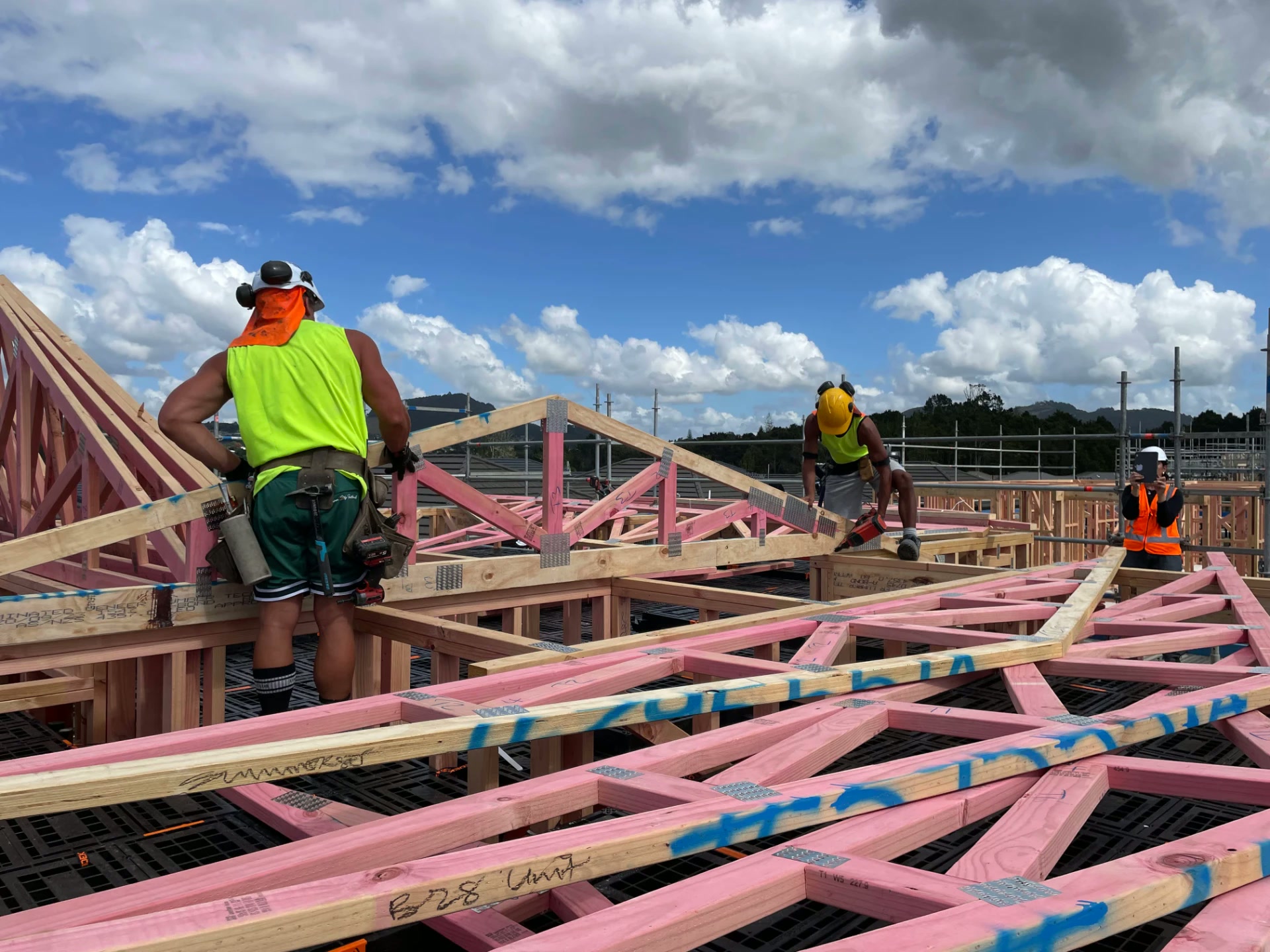 Builders installing roof trusses from a Workdek platform at Summerset Whangārei