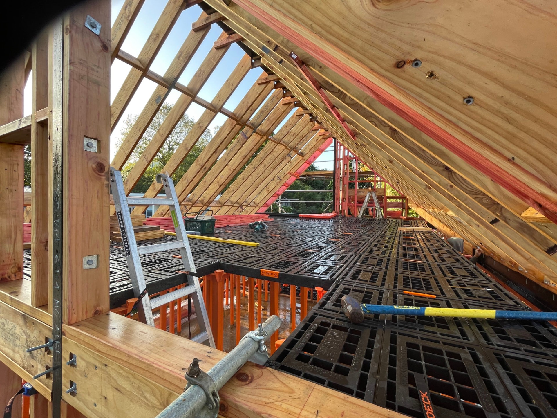Platform installed around the framing inside an existing pitched roof